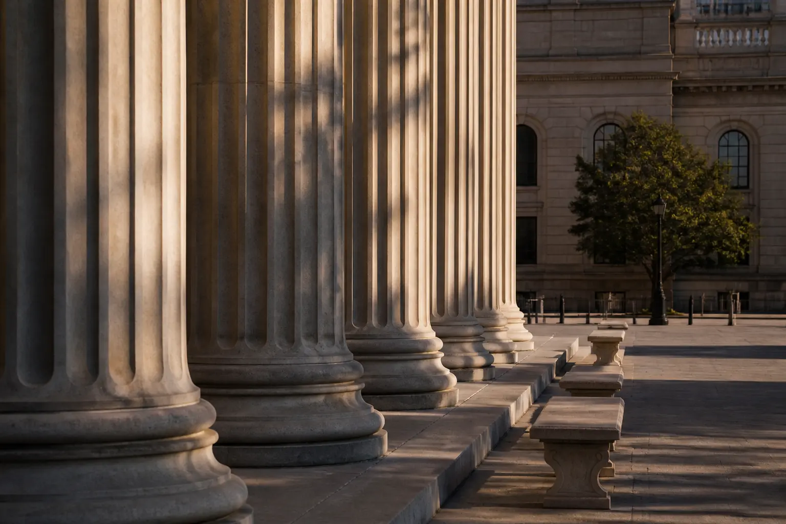 A civic stone colonnade and quiet plaza